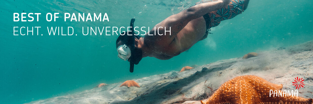 Ein Taucher mit Schnorchelmaske schwimmt unter Wasser